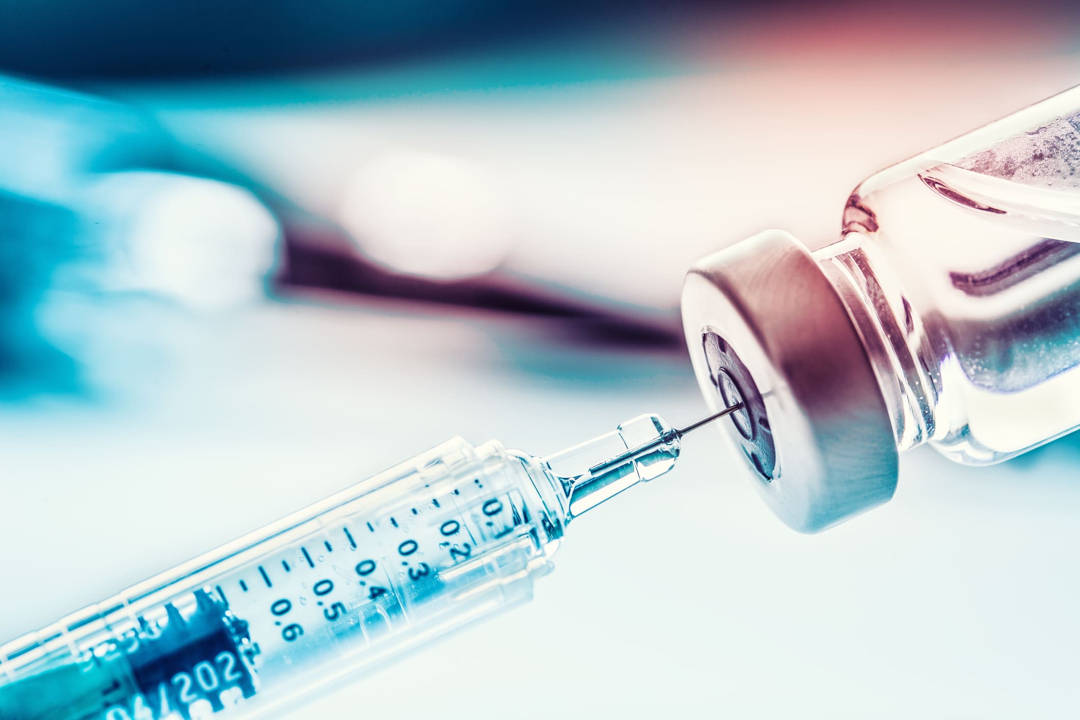 Closeup medical syringe with a vaccine. Unified Information Devices